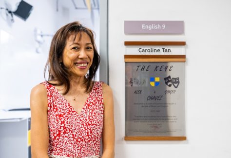 Caroline Tan next to her plaque