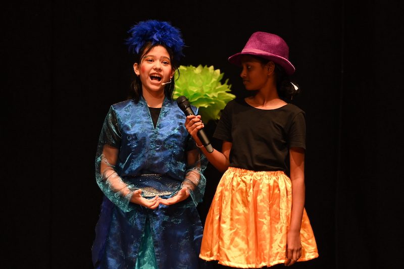 Elementary students performing during the musical